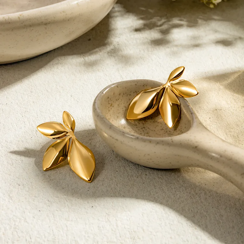 Golden Leaf Statement Stud Earrings - Image 3